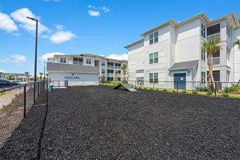 a view of the dog park at the enclave at woodbridge apartments in sugar land, tx