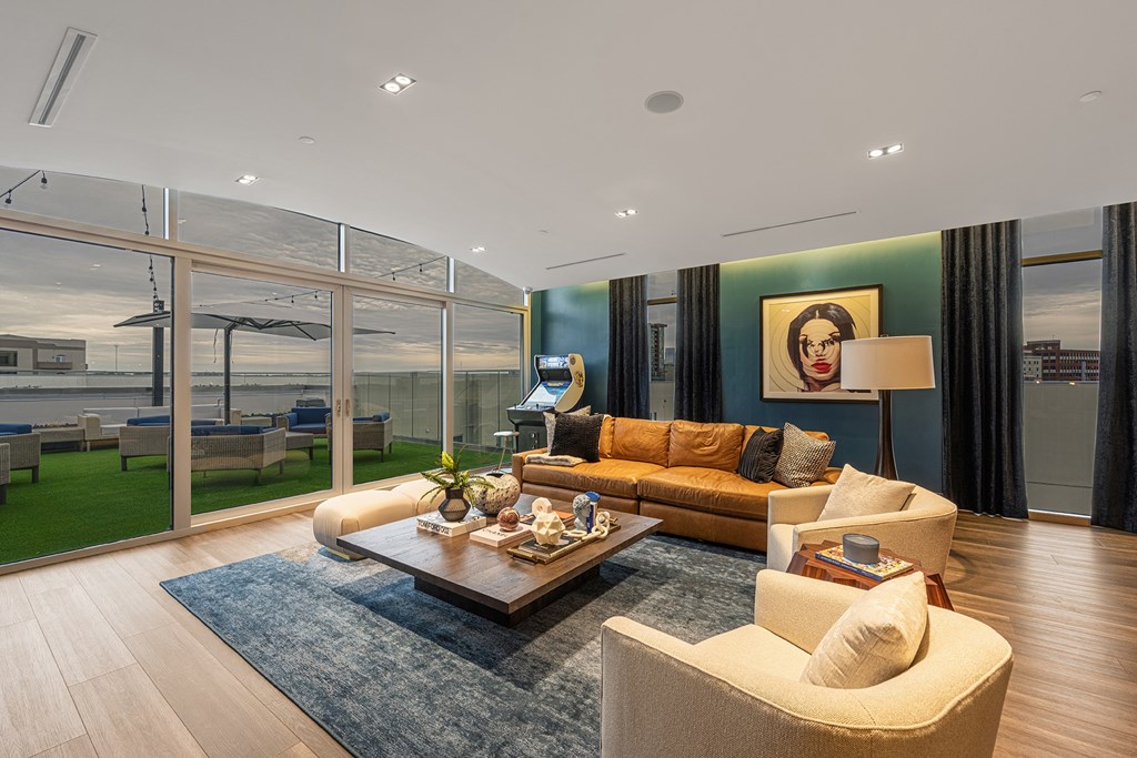 a living room with a couch and a coffee table on a rug