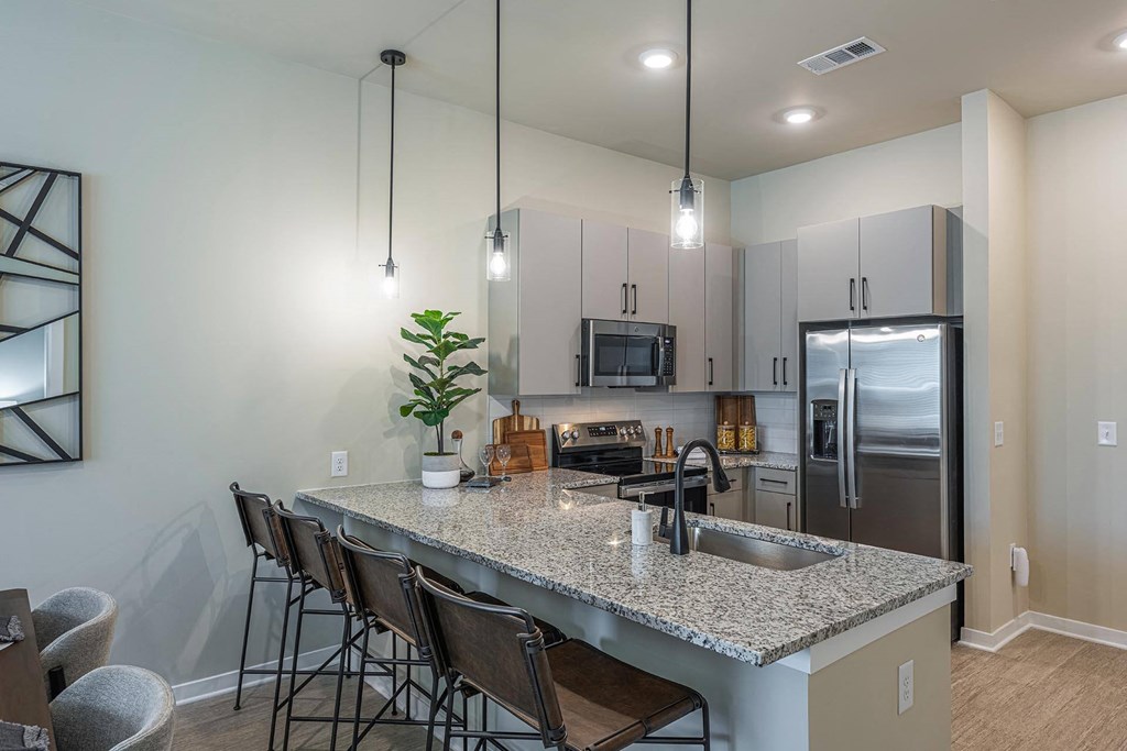 a kitchen with a granite counter top
