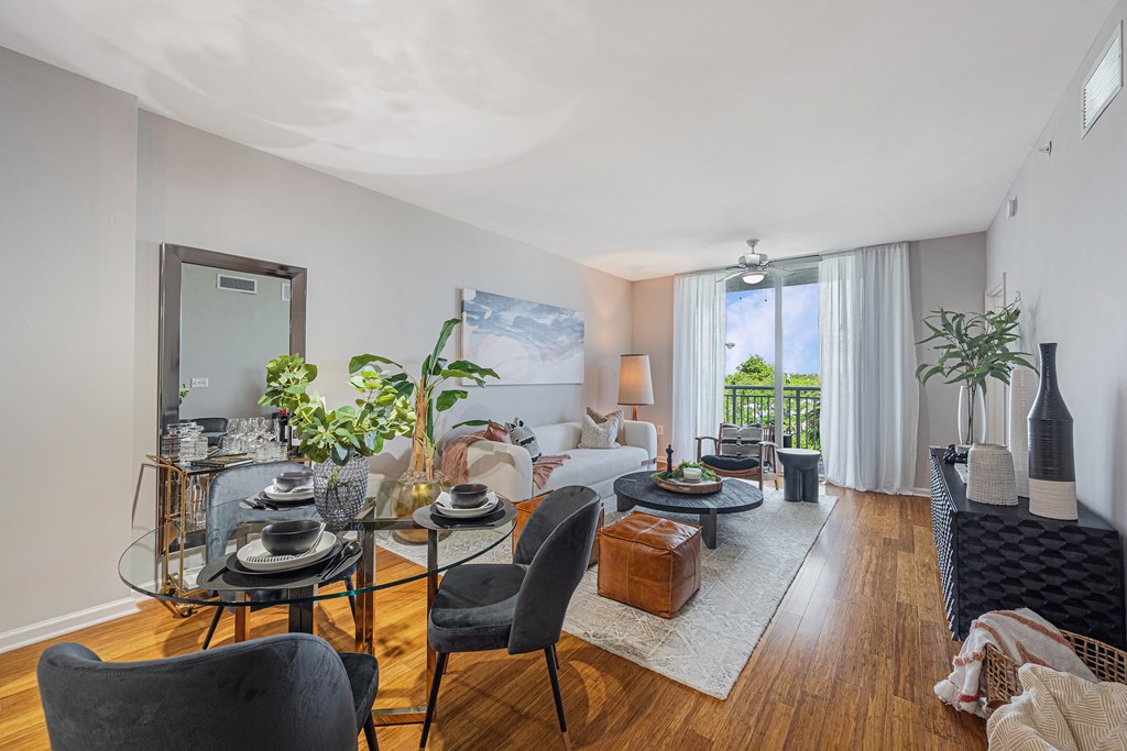 a living room with a couch and a table with chairs