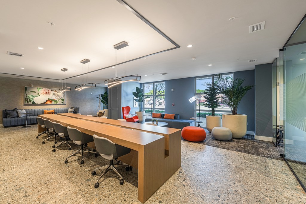 a conference room with a long wooden table and chairs