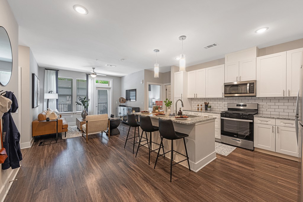 modern kitchen with a dining table and chairs.