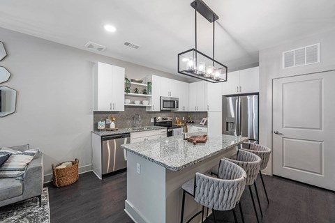 a kitchen with a counter top and a refrigerator