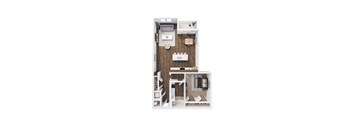 A small room with a bed, desk, and a toilet.