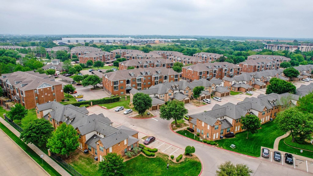 an aerial view of a neighborhood of brick houses