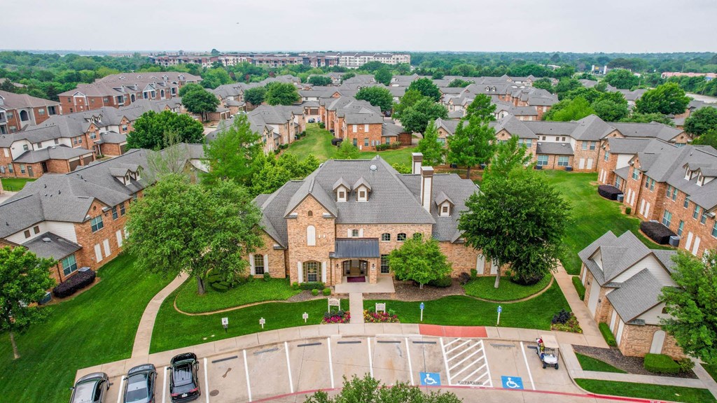an aerial view of a neighborhood with houses and cars