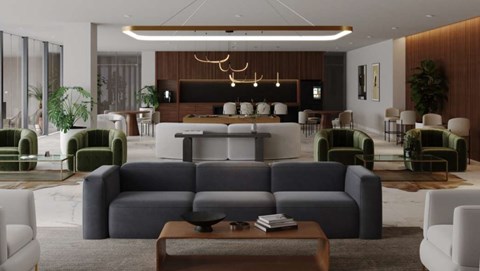 A modern living room with a large grey sofa and a wooden coffee table.