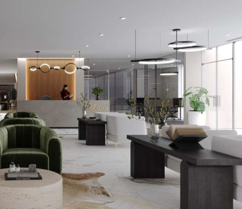 A modern office space with a reception desk, green armchairs, and a cowhide rug.