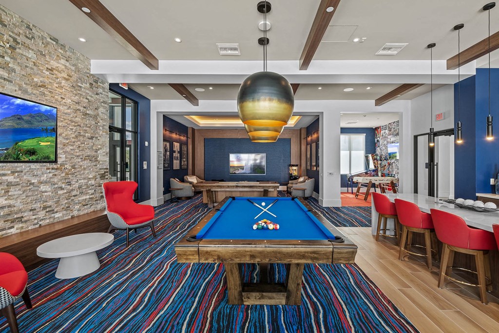 a game room with a pool table and a television at Altis Blue Lake, Lake Worth, Florida