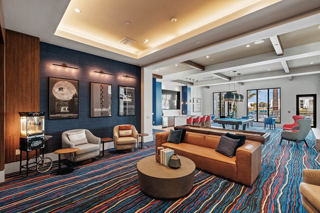 a living room with couches and chairs and a table at Altis Blue Lake, Lake Worth, FL, 33467