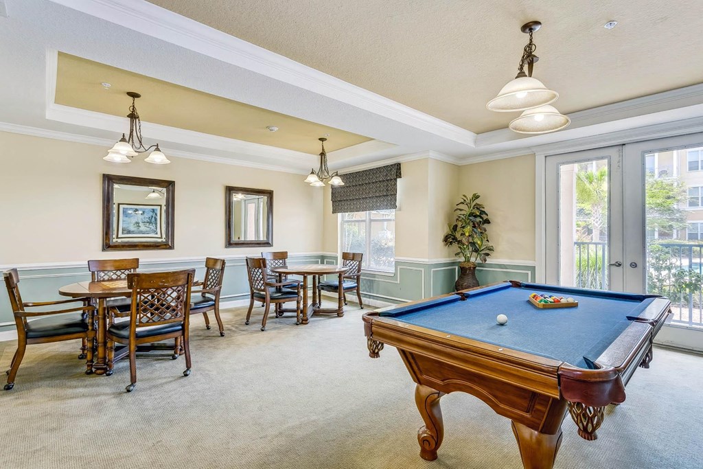a game room with a pool table