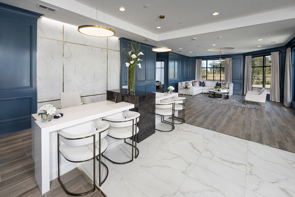 a salon with white marble floors and blue walls and white chairs