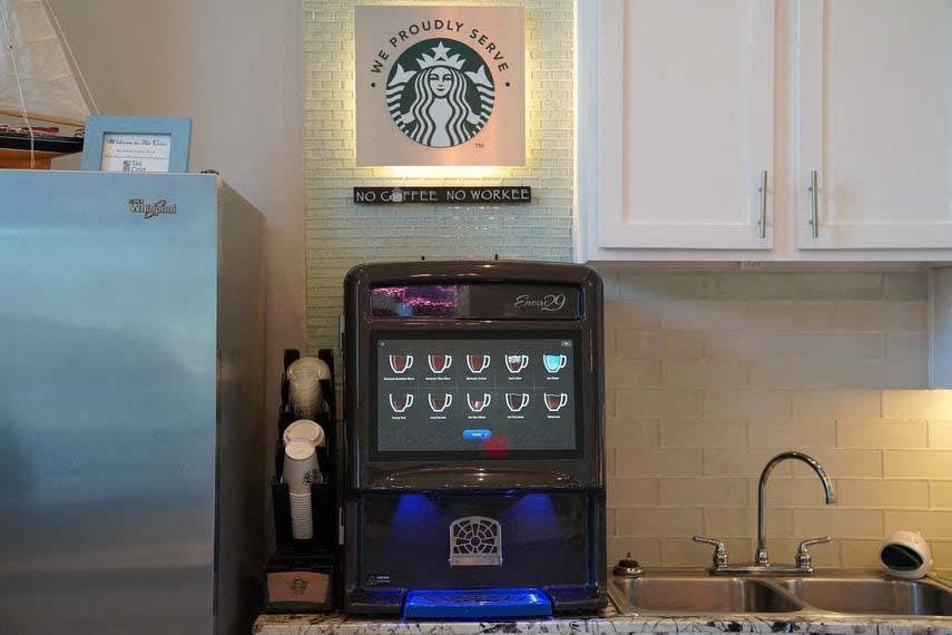 a kitchen with a microwave and a refrigerator
