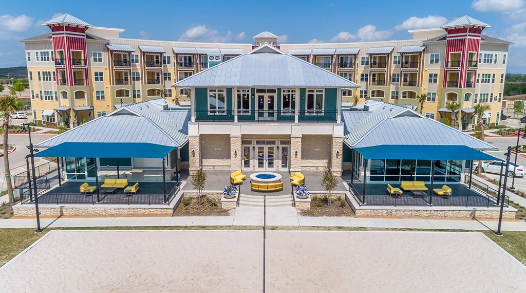 Apartments for Rent in Lewisville TX - Hebron 121 Station - Relaxing Fire Pit with Comfortable Seating, Clubhouse, and Umbrellas