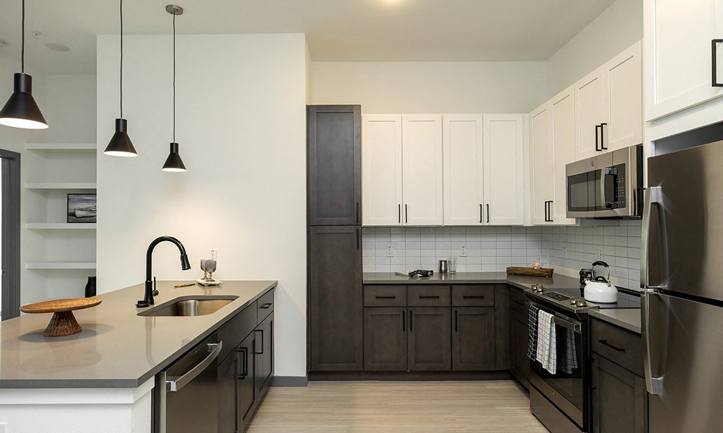 Modern kitchen with sleek design and stainless steel appliances in Apollo Beach, Florida.