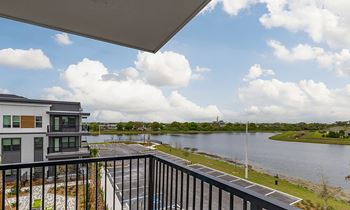 the view from the balcony of a condo overlooking the water