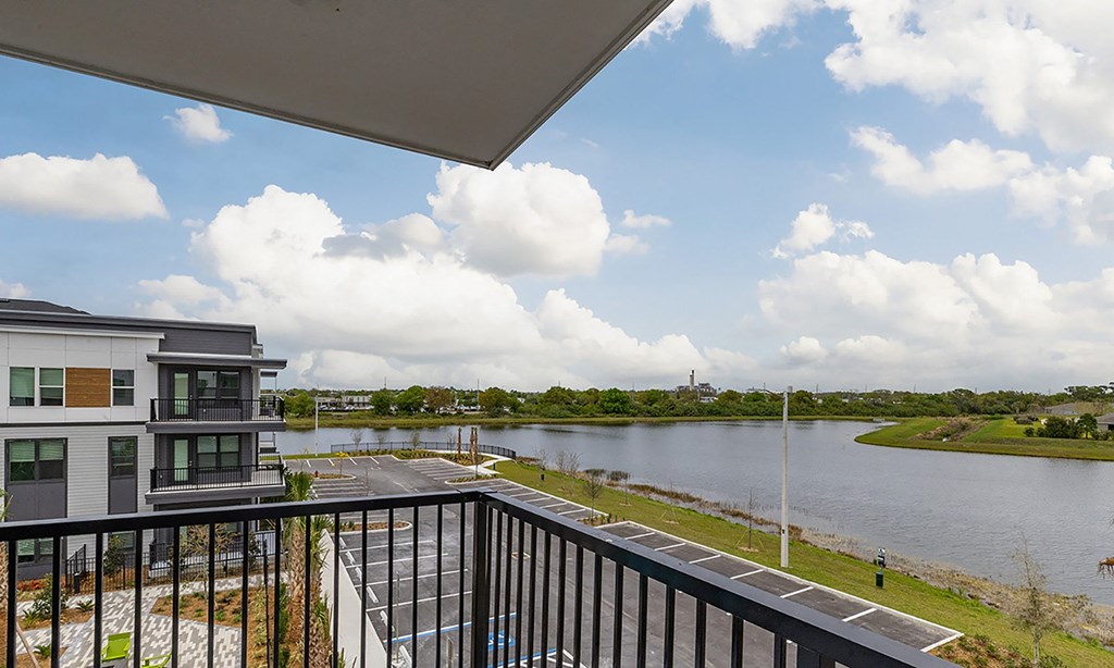 the view from the balcony of a condo overlooking the water in apollo beach, florida