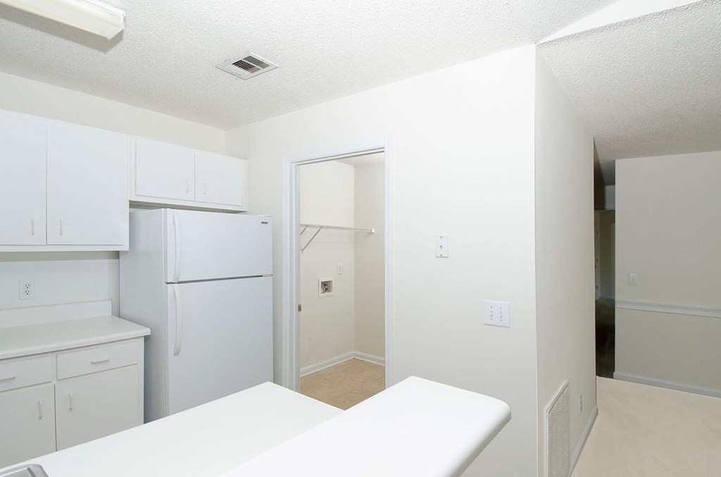kitchen with view into utility