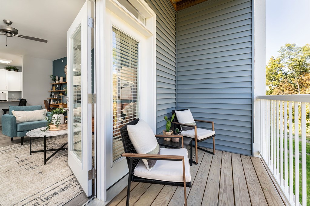 A patio with a table and chairs is shown.
