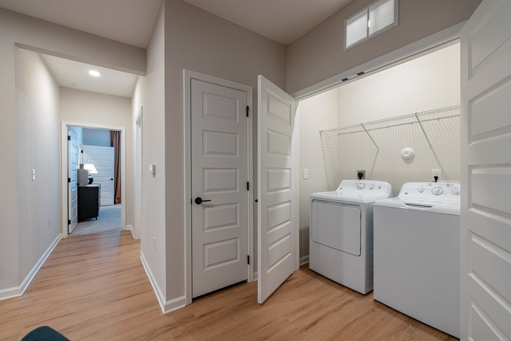 A bathroom with two sinks and a shower.