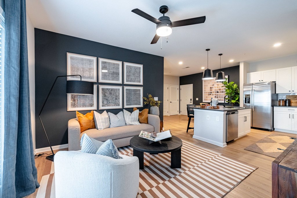 A modern living room with a grey sofa and a coffee table.