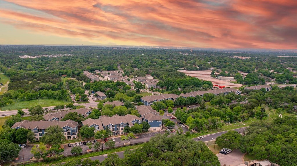an aerial view of a neighborhood with houses and trees