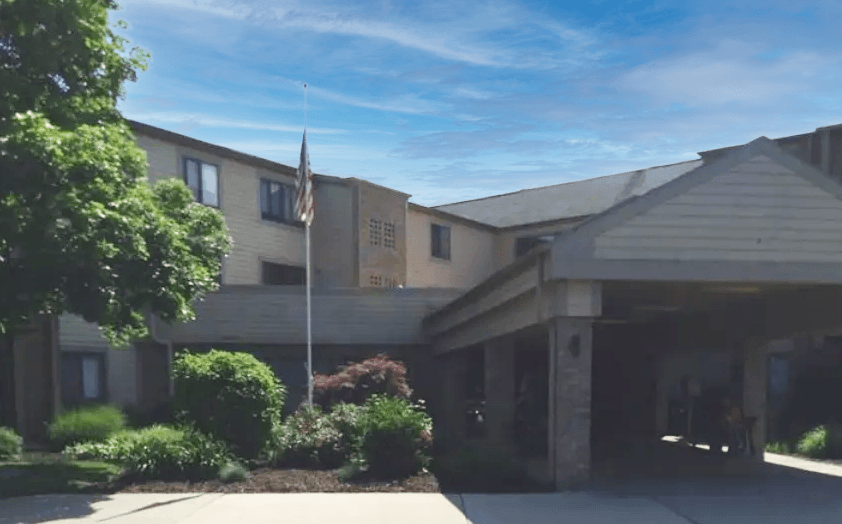 a building with an american flag in front of it