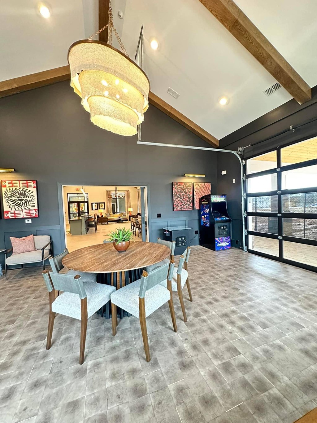 a dining room with a wooden table and chairs