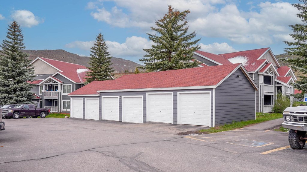 a row of garages in front of some houses