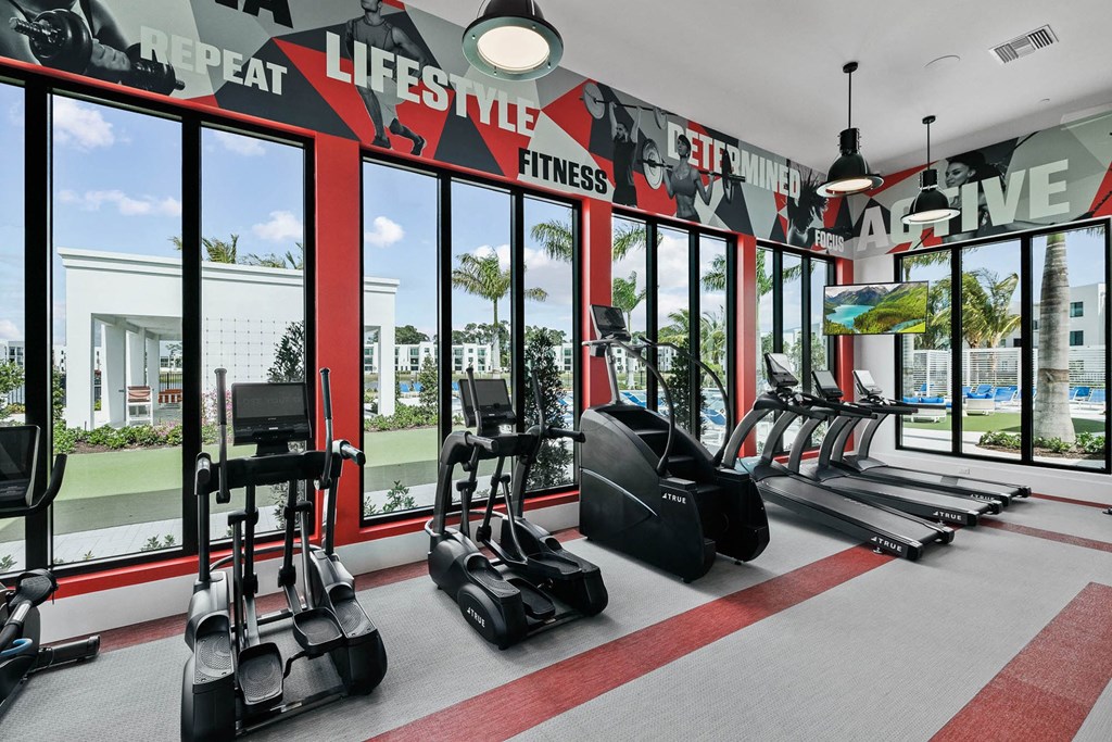 the gym at the flats at big tex apartments at Altis Blue Lake, Lake Worth, FL, 33467