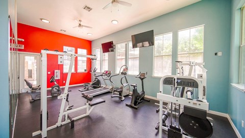 a room with a painted wall and a bunch of chairs