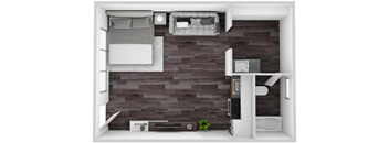 A small room with a bed, a desk, and a chair.