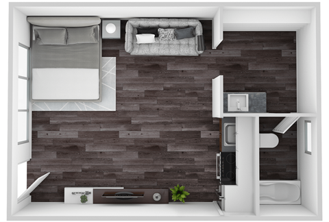 A small room with a bed, a desk, and a chair.