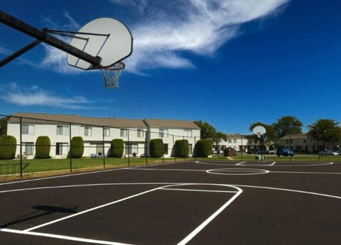 a basketball court in front of a building