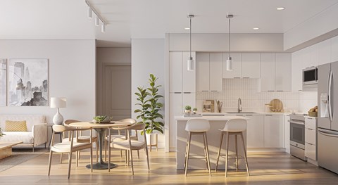 A modern kitchen with a dining table and chairs.