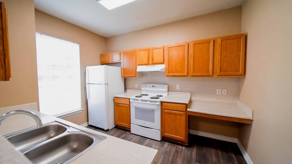 full kitchen with white appliances and wooden cabinets