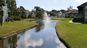 A resort-style community with lush landscaping and lake views at Lake in the Woods, Melbourne, FL - Photo Gallery 12