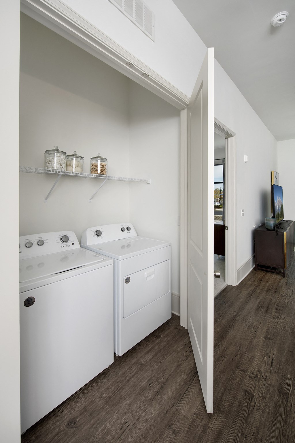 a laundry room with two washes and a dryer in it