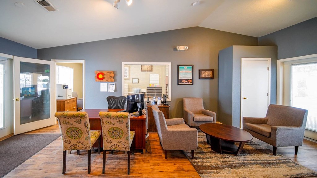 a living room with a dining room table and chairs