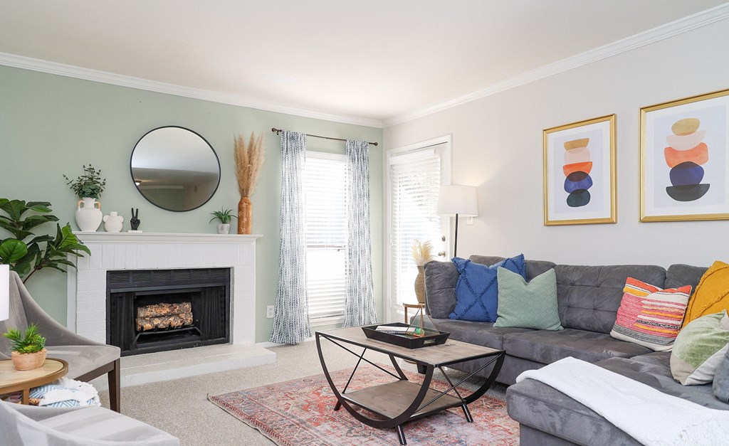 a living room with a couch and a fireplace