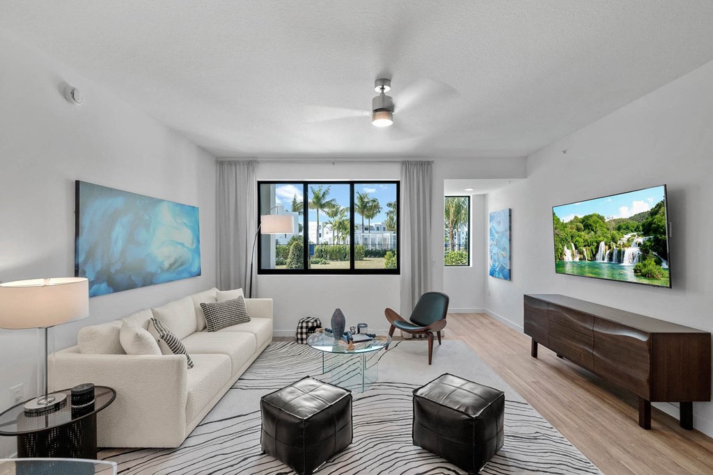 a living room with a couch and a table at Altis Blue Lake, Lake Worth, FL, 33467