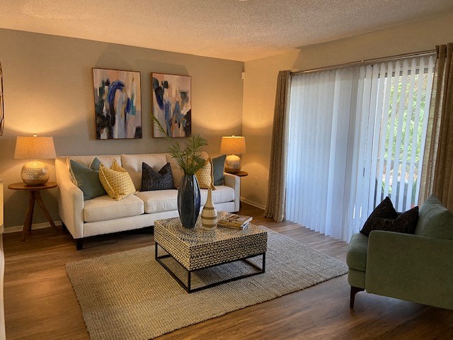 Entertain guests in an open concept living room at Lake in the Woods, Melbourne, Florida