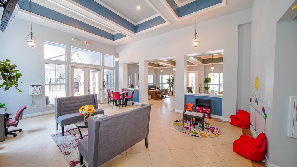 a living room with couches and chairs and a fireplace