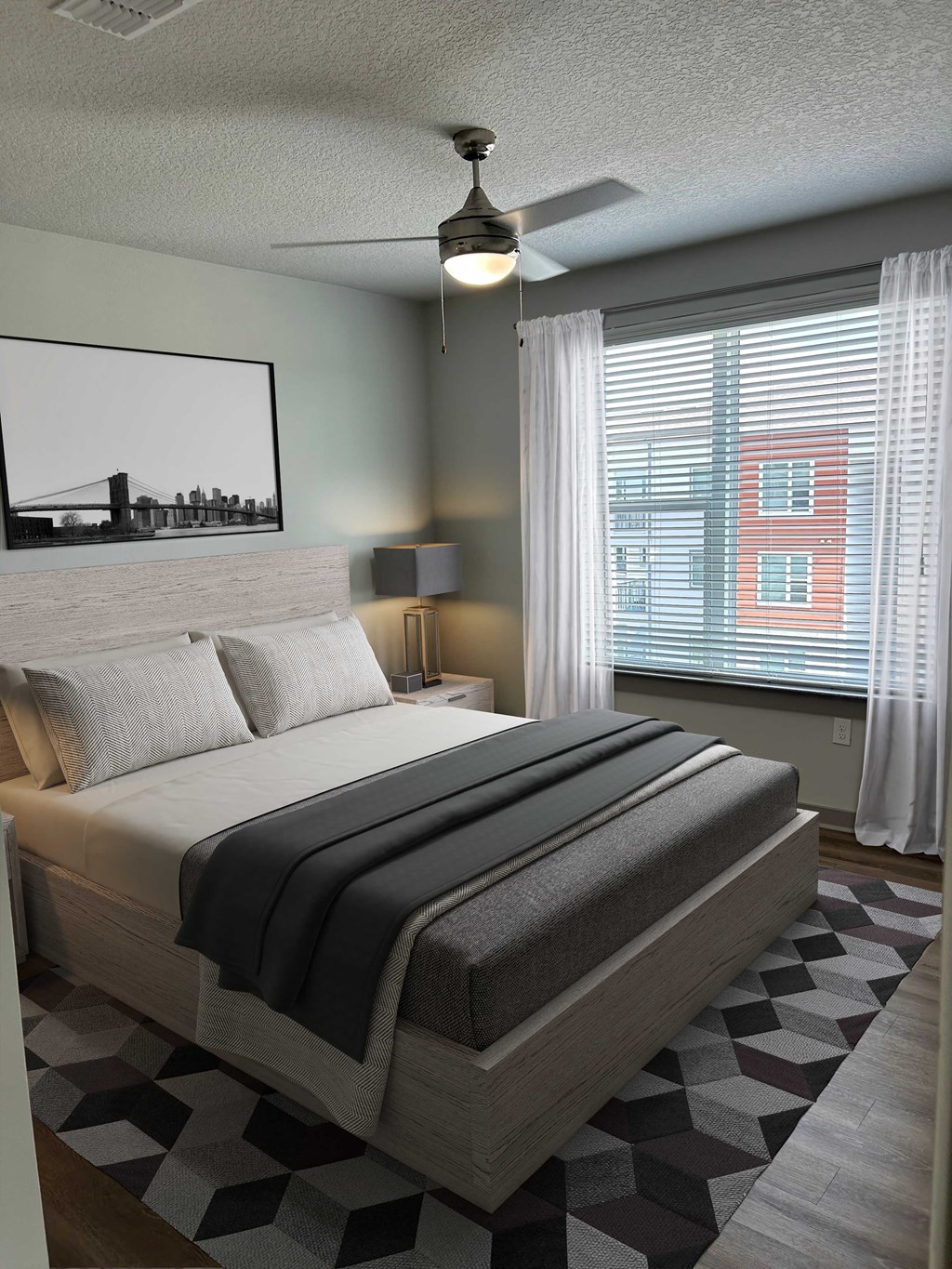 A bedroom with a large bed and a painting of a bridge on the wall.