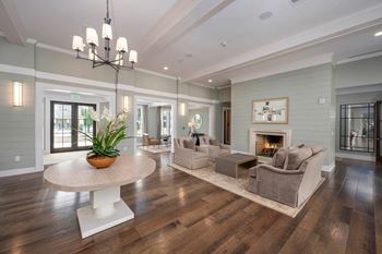 a living room with couches and a table