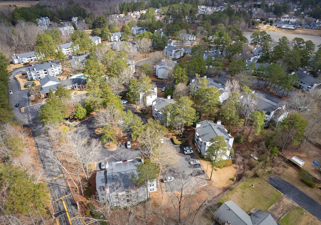 an aerial view of a neighborhood with houses and trees