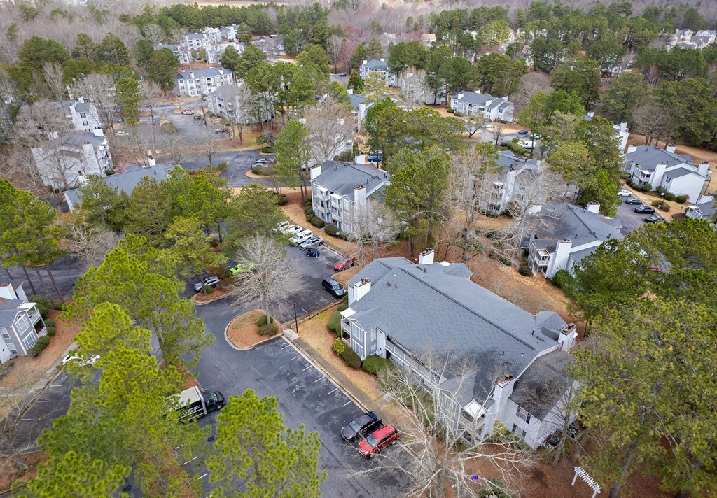 an aerial view of a neighborhood with houses and trees
