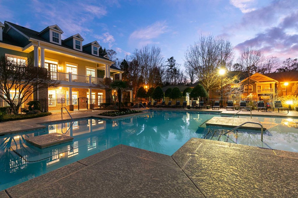 A large house with a pool in the backyard.