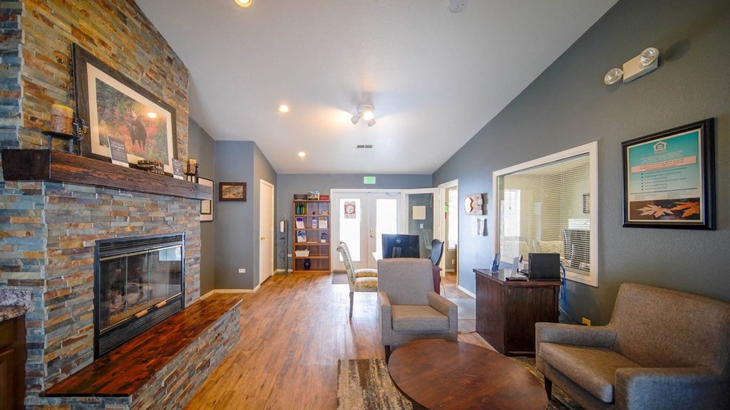 a living room with a fireplace and a table