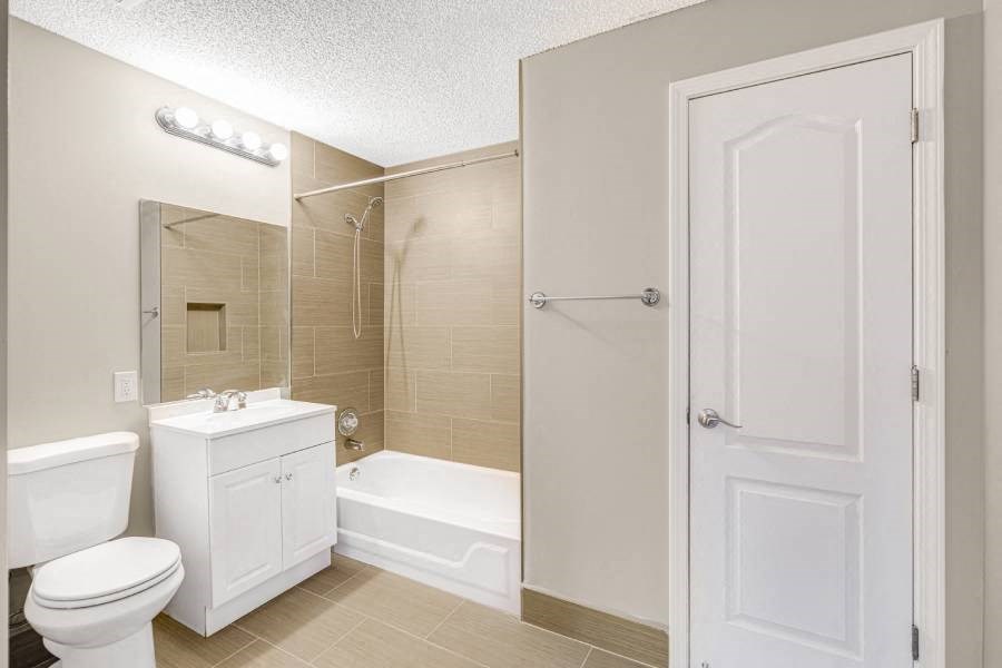 a bathroom with a sink toilet and a shower